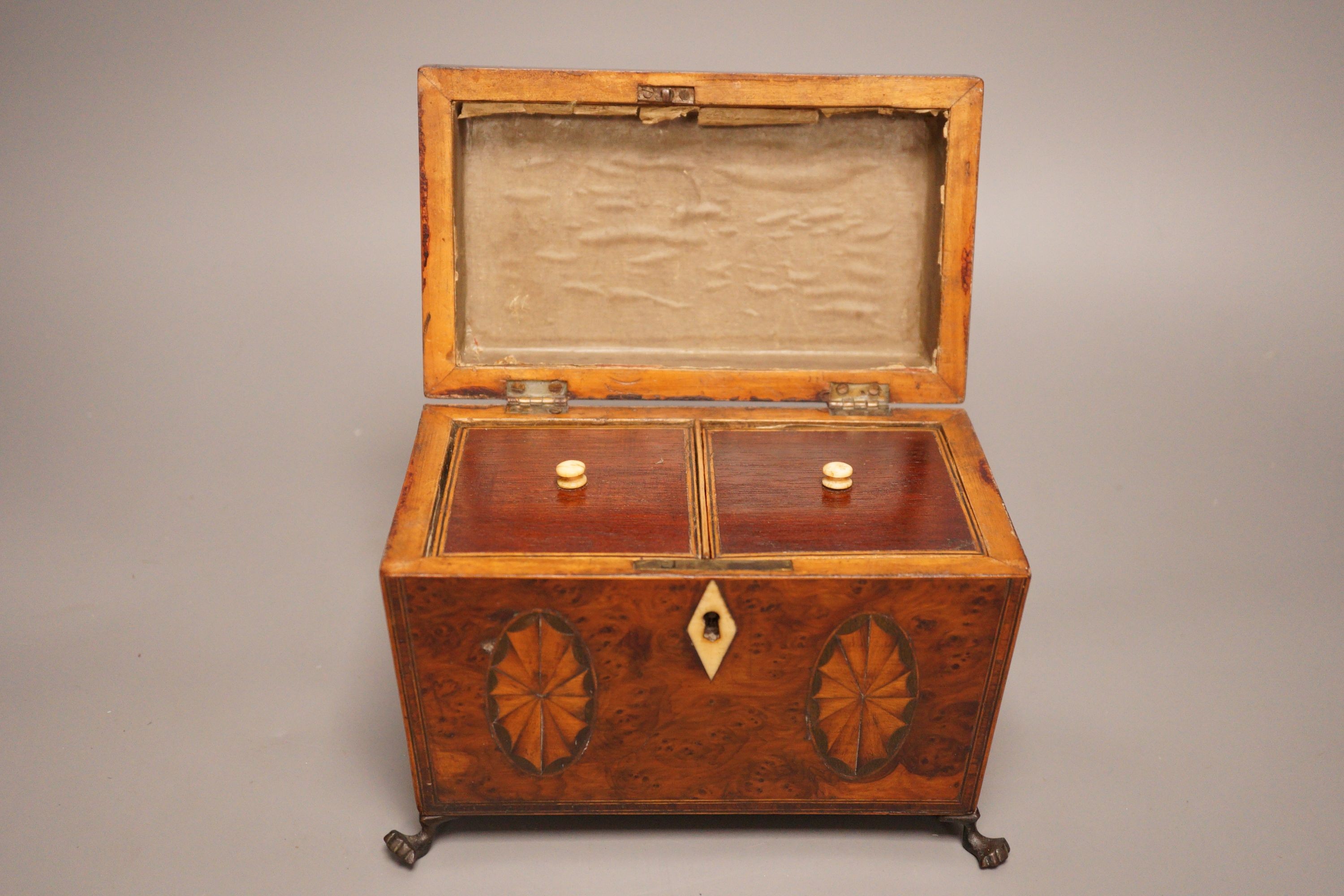 A Regency inlaid burr yew tea caddy, ivory escutcheon, 19cm foot to foot